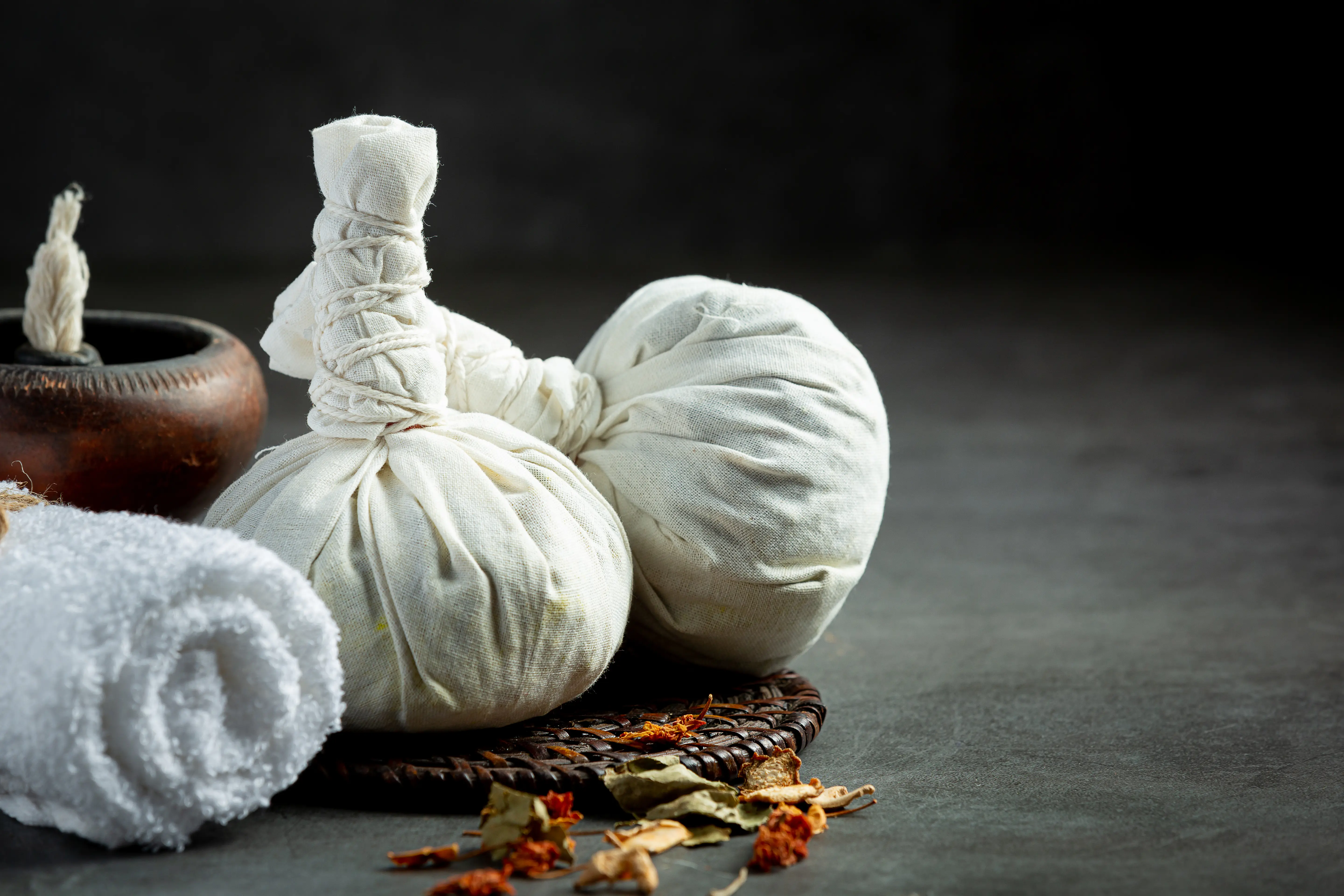 herbal-compress-herbal-spa-treatment-equipments-put-dark-floor